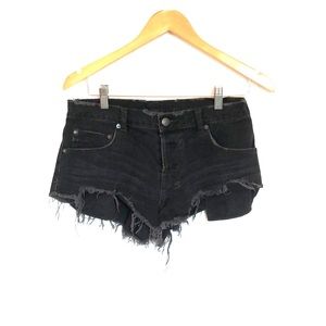 Black distressed KSUBI shorts
